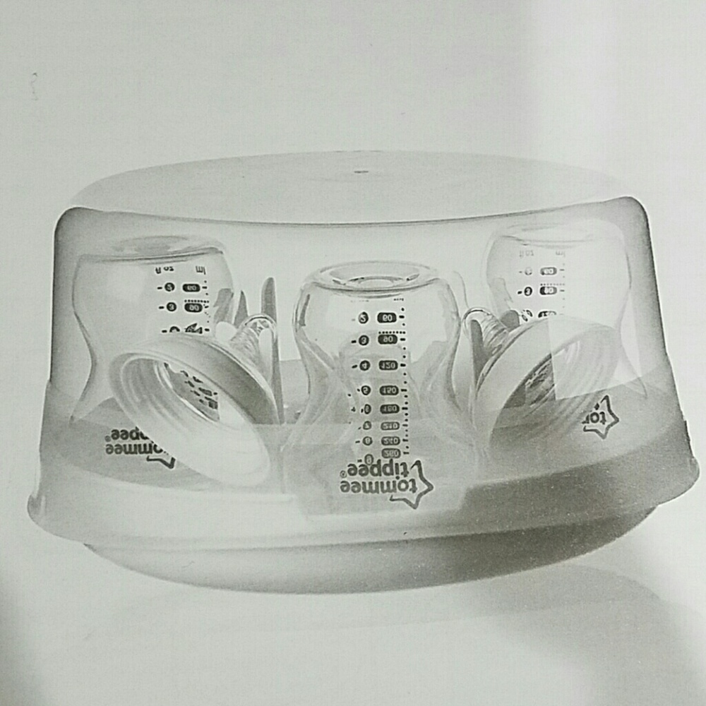 Brand New Tommee Tippee Sterilizer and 4 bottles